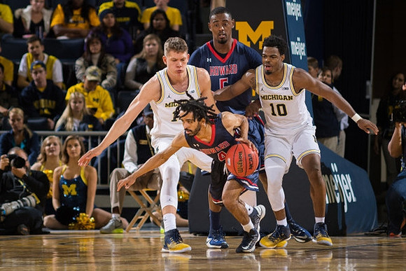 Moritz Wagner (13) and Derrick Walton Jr. (10)