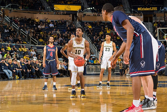Derrick Walton Jr. (10) and Ibi Watson (23)
