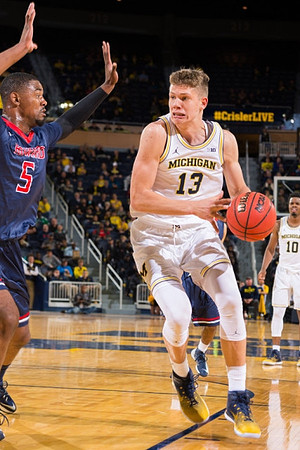 Moritz Wagner (13) and Derrick Walton Jr. (10)