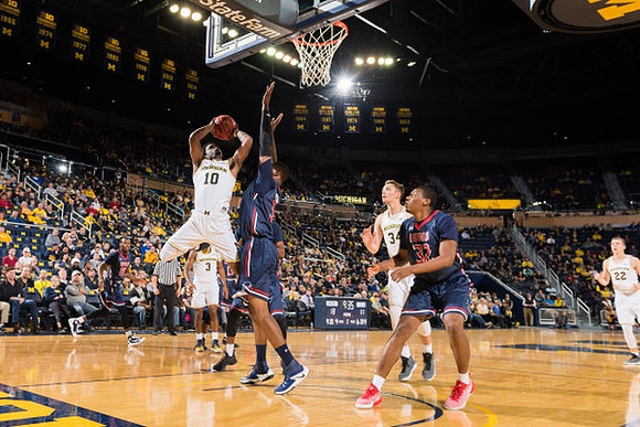 Derrick Walton Jr. (10), Xavier Simpson (3), Mark Donnal (34), and Duncan Robinson (22)