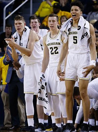 Moritz Wagner (13), Duncan Robinson (22), and D.J. Wilson (5)