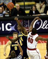 Zack Novak (0) and DeShawn Sims (34)