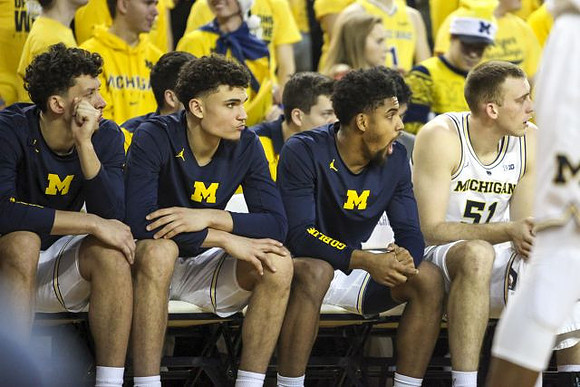 Brandon Johns Jr. (23), Adrien Nunez (5), David DeJulius (0), and Austin Davis (51)