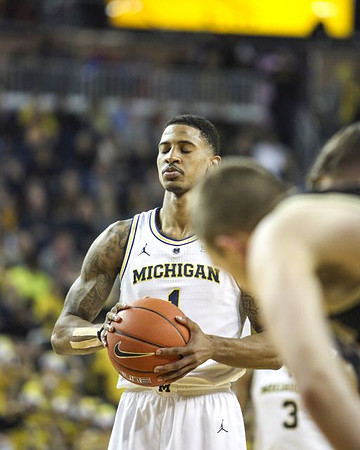 Charles Matthews (1) and Zavier Simpson (3)