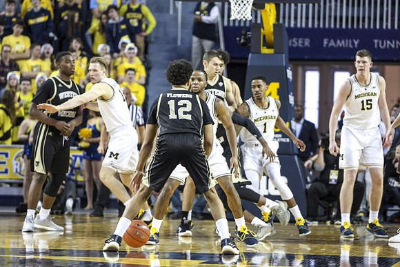 Ignas Brazdeikis (13), Zavier Simpson (3), Charles Matthews (1), and Jon Teske (15)