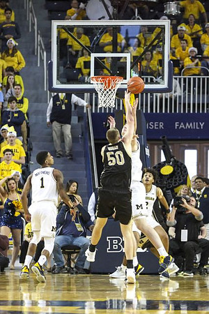 Charles Matthews (1), Ignas Brazdeikis (13), and Jordan Poole (2)
