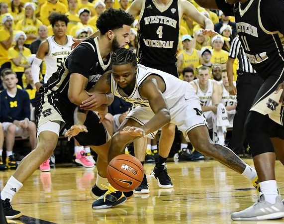 Eli Brooks (55) and Zavier Simpson (3)