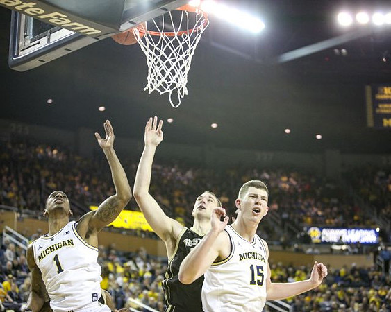 Charles Matthews (1) and Jon Teske (15)