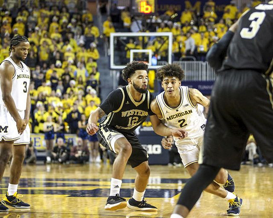 Zavier Simpson (3) and Jordan Poole (2)