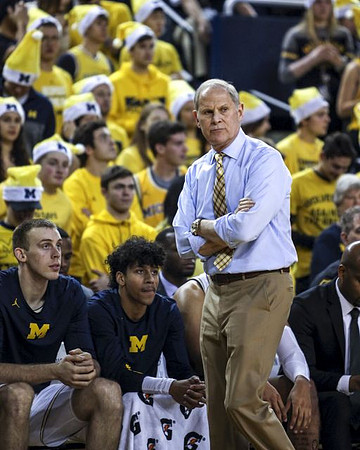 Austin Davis (51), Eli Brooks (55), and John Beilein