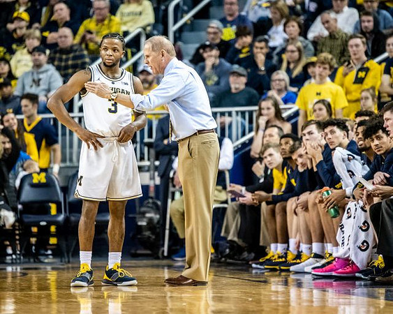 Zavier Simpson (3), John Beilein, and Michigan Team