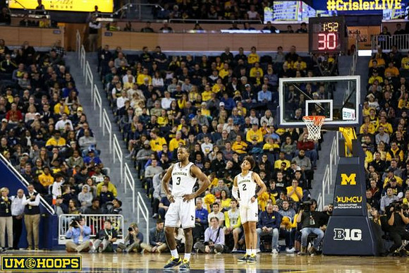 Zavier Simpson (3) and Jordan Poole (2)