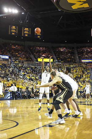 Charles Matthews (1) and Jon Teske (15)