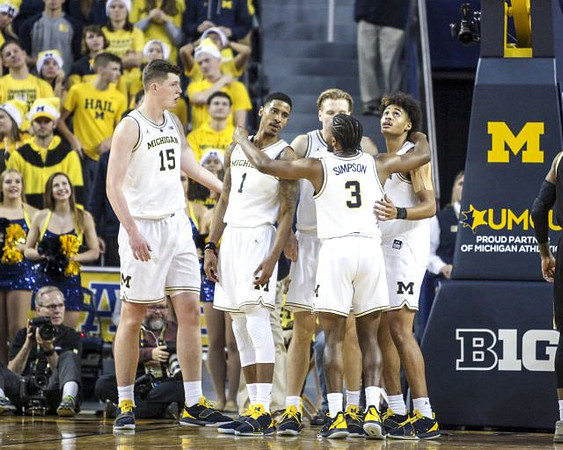 Jon Teske (15), Charles Matthews (1), Ignas Brazdeikis (13), Zavier Simpson (3), and Jordan Poole (2)