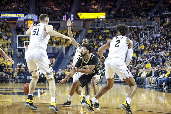 Austin Davis (51), Zavier Simpson (3), and Jordan Poole (2)