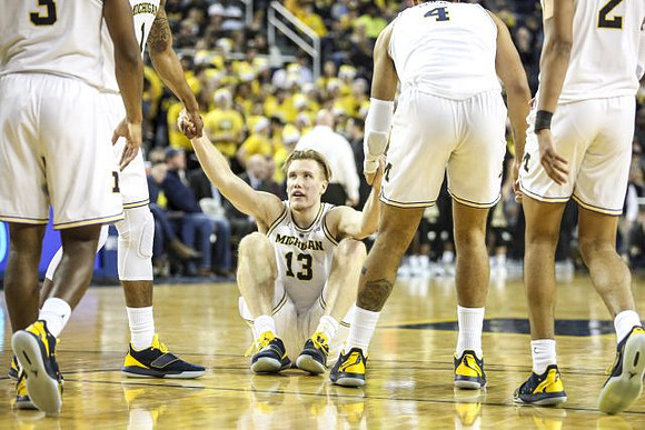 Zavier Simpson (3), Charles Matthews (1), Ignas Brazdeikis (13), Isaiah Livers (4), and Jordan Poole (2)
