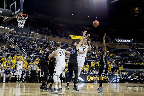 Moritz Wagner (13), Mark Donnal (34), and Duncan Robinson (22)