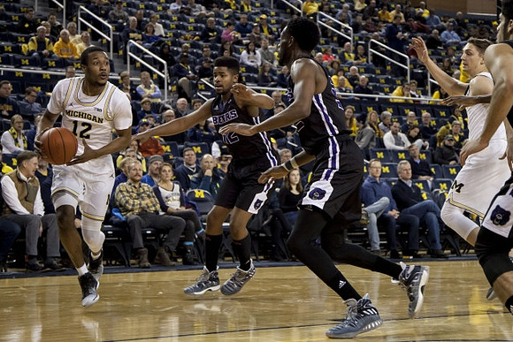 Muhammad-Ali Abdur-Rahkman (12) and Mark Donnal (34)