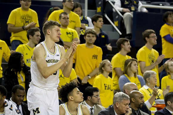 Moritz Wagner (13) and Michigan Team