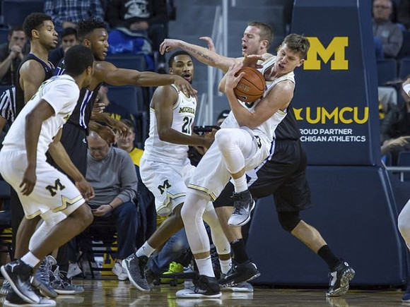 Muhammad-Ali Abdur-Rahkman (12), Zak Irvin (21), and Moritz Wagner (13)