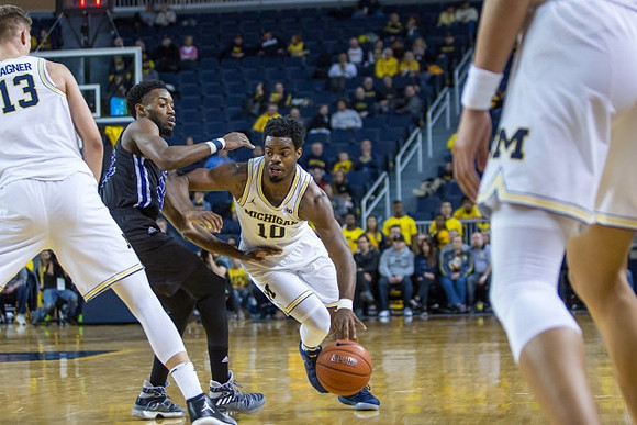 Derrick Walton Jr. (10) and Moritz Wagner (13)