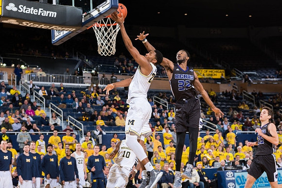 Derrick Walton Jr. (10) and Zak Irvin (21)
