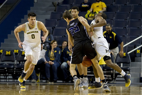 Brent Hibbitts (0) and Xavier Simpson (3)