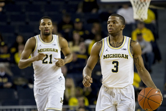 Zak Irvin (21) and Xavier Simpson (3)