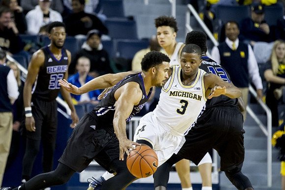 Xavier Simpson (3) and D.J. Wilson (5)
