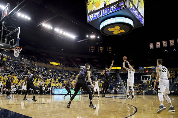 Zak Irvin (21), Mark Donnal (34), and Duncan Robinson (22)