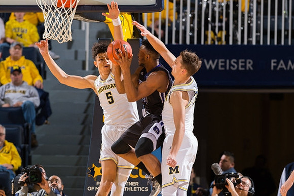 D.J. Wilson (5) and Mark Donnal (34)