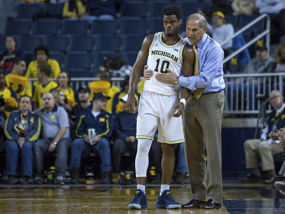 Derrick Walton Jr. (10) and John Beilein