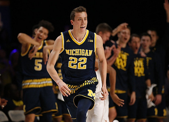 D.J. Wilson (5) and Duncan Robinson (22)