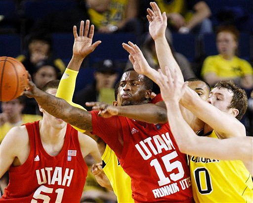 Zack Novak (0) and Jon Horford (15)