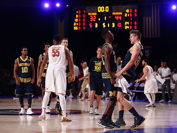 Derrick Walton Jr. (10), Aubrey Dawkins (24), Mark Donnal (34), Andrew Dakich (11), Caris LeVert (23), and Moritz Wagner (13)