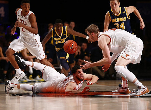Caris LeVert (23) and Mark Donnal (34)