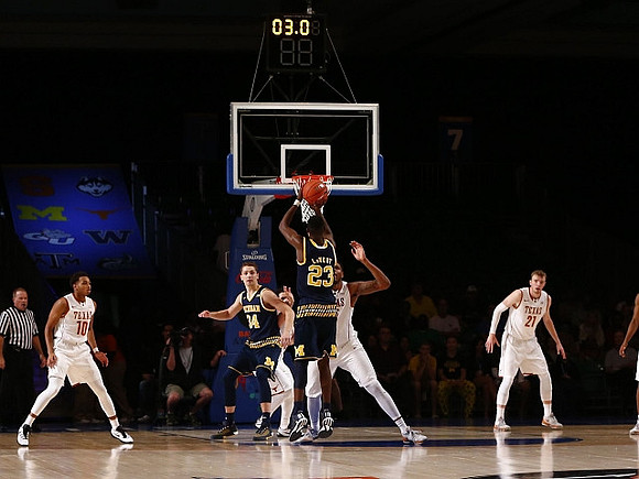 Mark Donnal (34) and Caris LeVert (23)