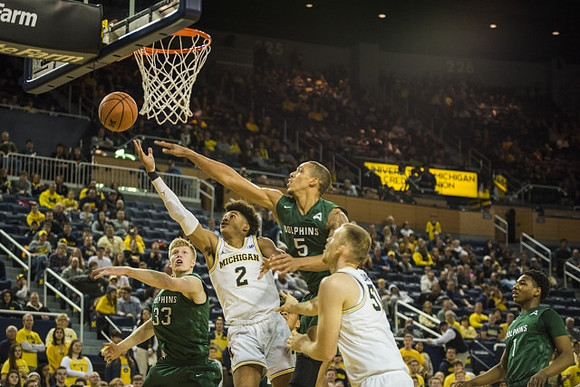 Jordan Poole (2) and Austin Davis (51)
