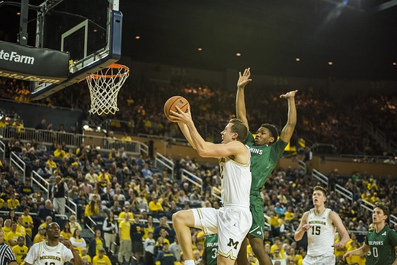Duncan Robinson (22) and Jon Teske (15)