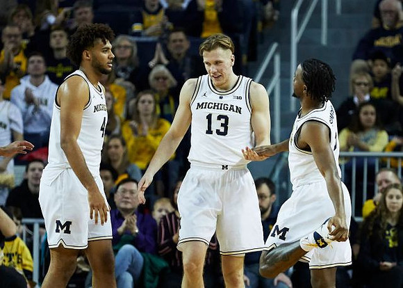 Isaiah Livers (4), Ignas Brazdeikis (13), and Zavier Simpson (3)
