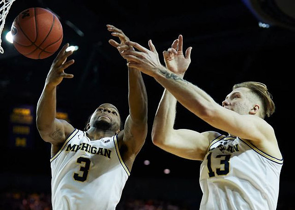 Zavier Simpson (3) and Ignas Brazdeikis (13)