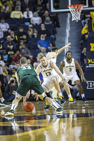 Ignas Brazdeikis (13), Austin Davis (51), and Zavier Simpson (3)