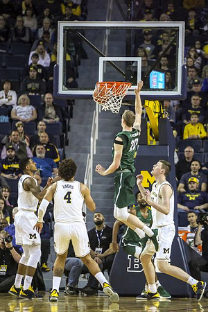 Charles Matthews (1), Isaiah Livers (4), and Jon Teske (15)