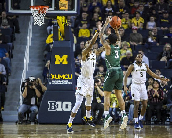 Charles Matthews (1) and Zavier Simpson (3)