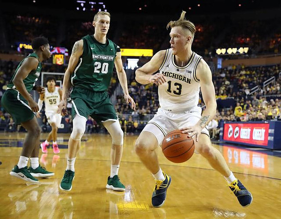 Ignas Brazdeikis (13) and Eli Brooks (55)