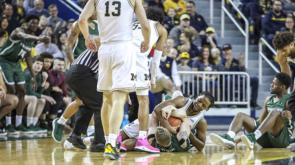 Ignas Brazdeikis (13), Eli Brooks (55), and Zavier Simpson (3)