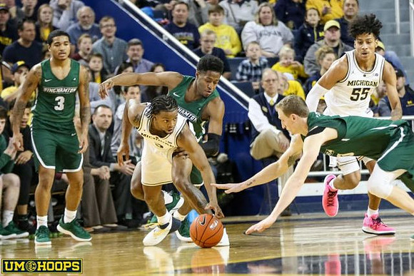 Zavier Simpson (3) and Eli Brooks (55)