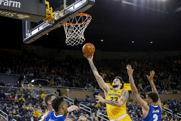 Brandon Johns Jr. (23) and Hunter Dickinson (1)