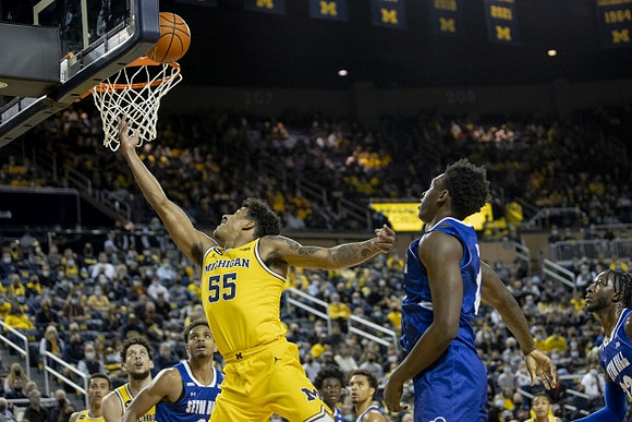 Caleb Houstan (22), Brandon Johns Jr. (23), and Eli Brooks (55)