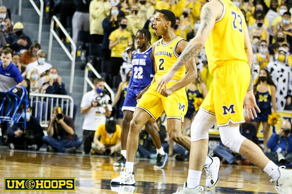 Kobe Bufkin (2) and Brandon Johns Jr. (23)